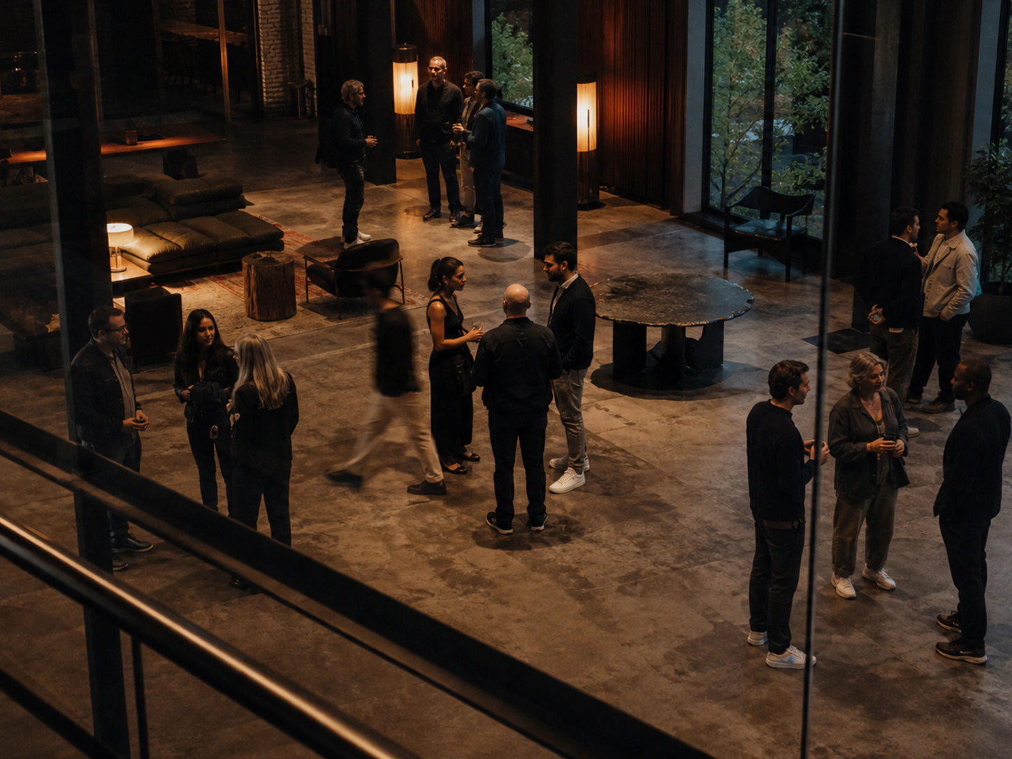Illustrative editorial scene of independent e-commerce operators in several peer conversations at a private evening gathering